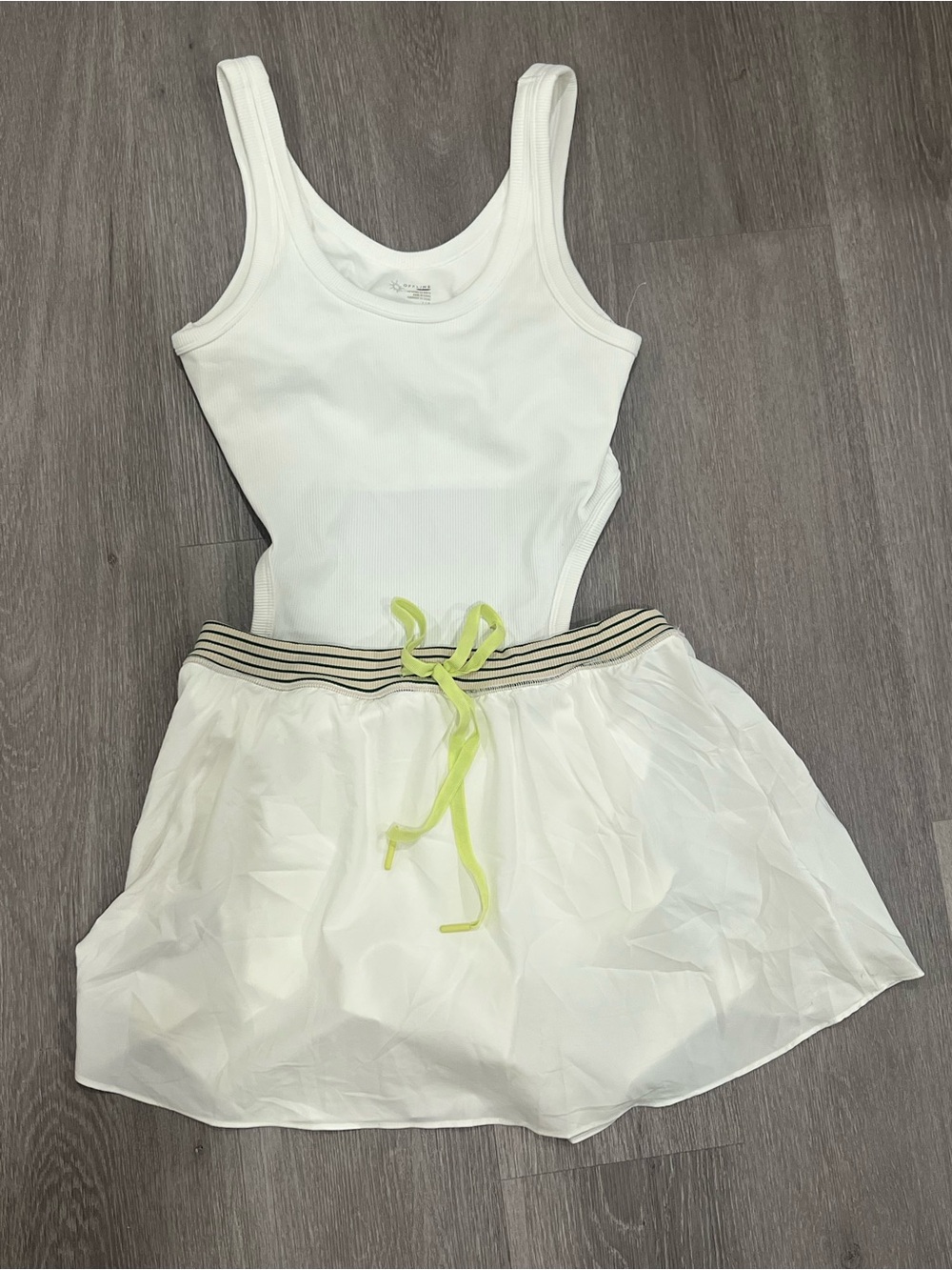 One piece tennis outfit. Skirt w/ shorts underneath, built in sports bra
